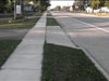 Photo - Driveway dips across grass strip.